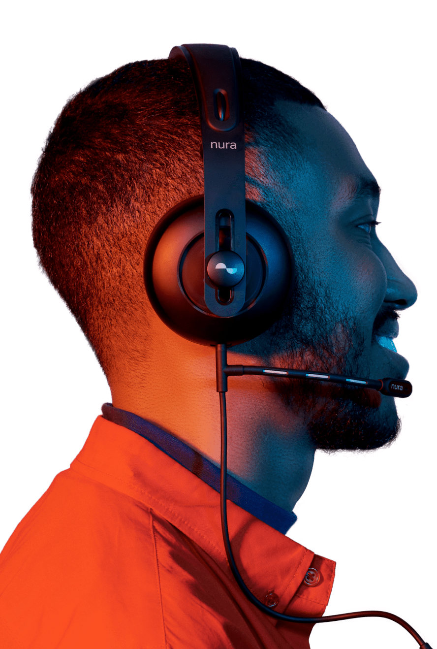 Photo of person wearing Nuraphone with gaming microphone attached