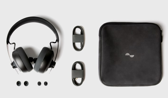 Photo of what's in the box, showing Nuraphone, soft travel case, USB-A cable, analogue cable, and 3 pairs multi-sized ear tips