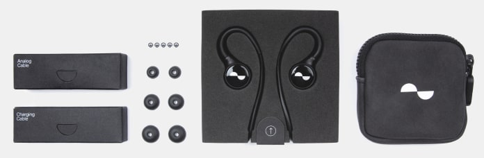 What's in the box, showing NuraLoop, travel case, 4 pairs multi-sized silicone ear tips, 5 replacement ear tip meshes, analog cable and charging cable